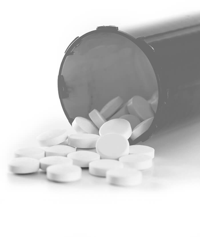 Tablets falling out of a cylinder